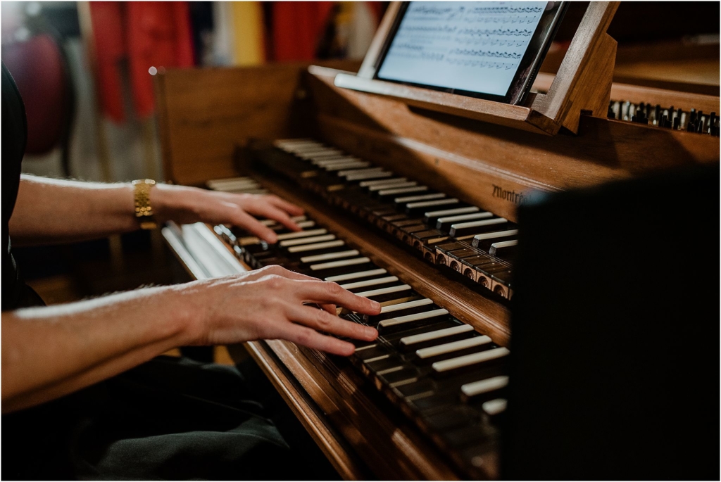 Valerie Hall's hands playing harpsichord Government House